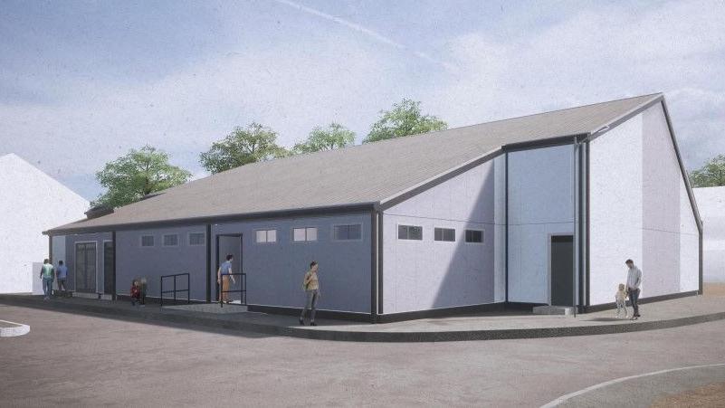 A CGI image of how the outside of the swimming pool could look. It is light grey in appearance with a dark grey roof.