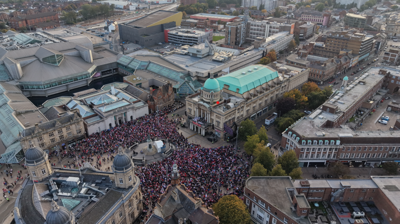 An aerial shot of the crowds in Victoria Square. The fans in red clothing are spread out to all corners of it.