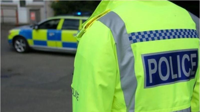 Stock image of police officer and car