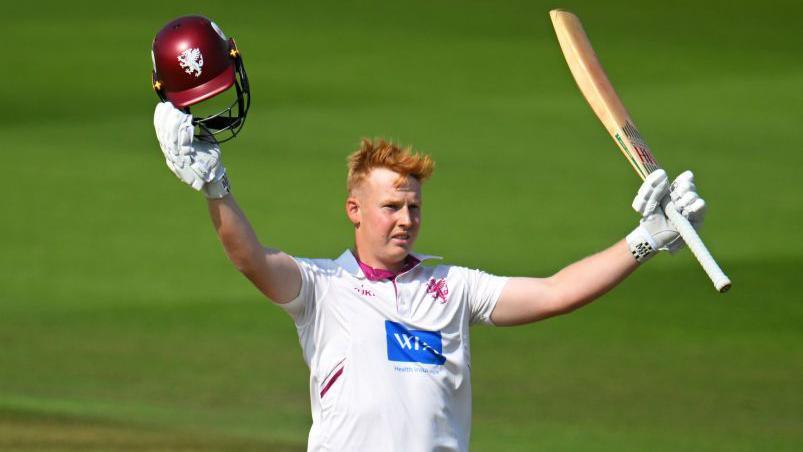 James Rew celebrates scoring a century for Somerset against Durham