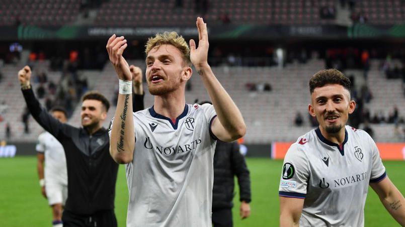 Bradley Fink claps the fans as he leaves the pitch for FC Basel.