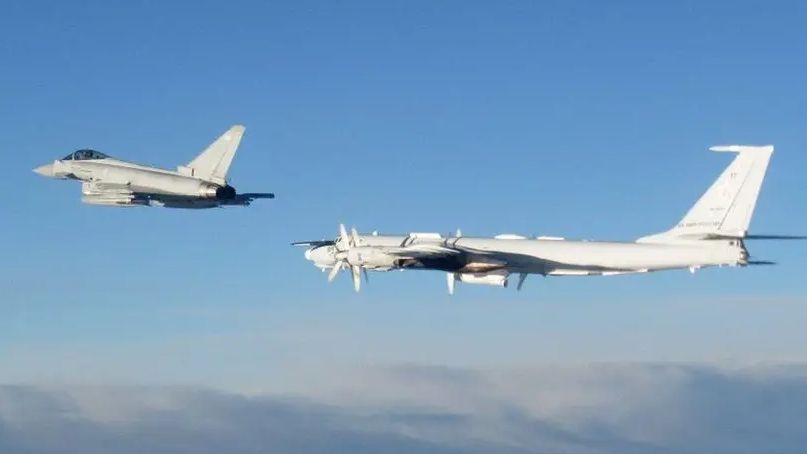 An RAF Typhon flies alongside a Russian aircraft on a previous interception