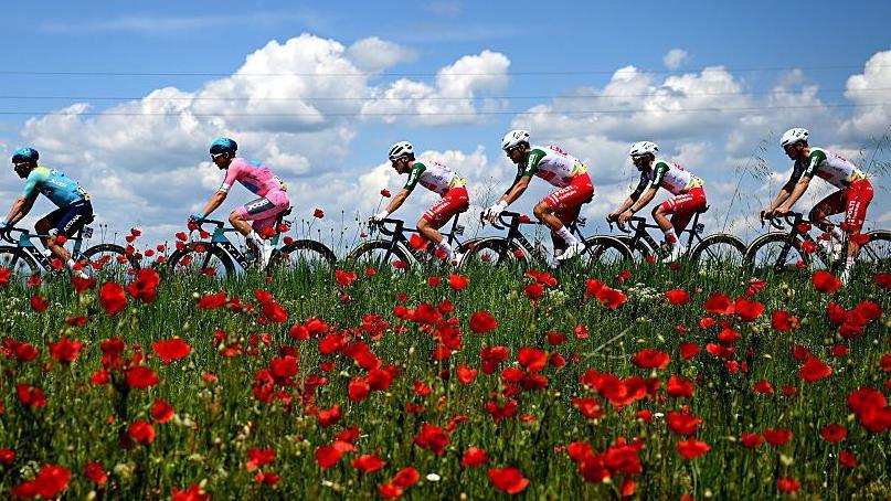 Guillermo Thomas Silva, second left, remains in pink after the peloton arrived in Sofia