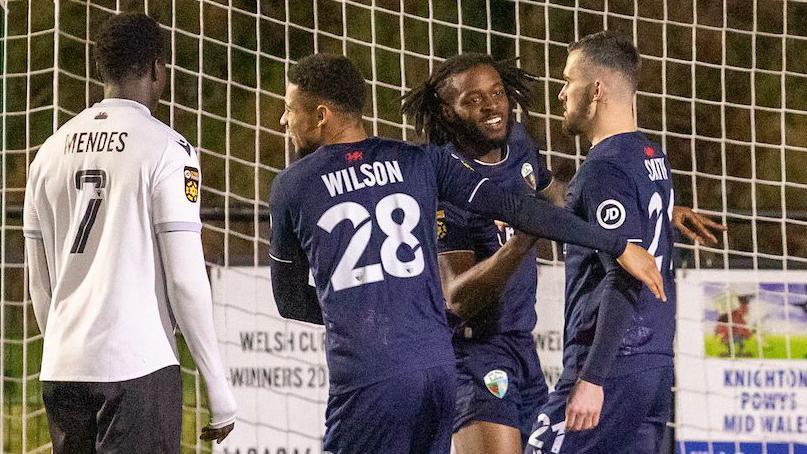 Leo Smith is congratulated by team-mates after his early goal for The New Saints against Bala