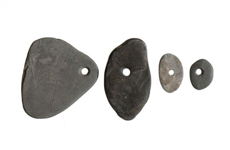 Engraved shale pendants