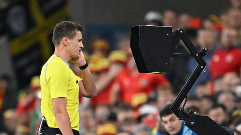 Referee Daniel Siebert views a monitor