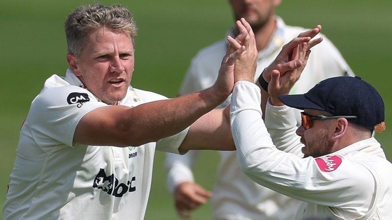 Timm van der Gugten of Glamorgan (L) celebrates as he dismisses Ajinkya Rahane of Leicestershire caught by Sam Northeast