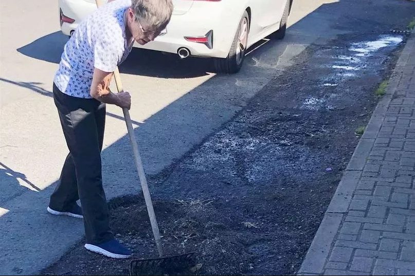 Jenny Paterson filling in potholes at her home in Caithness