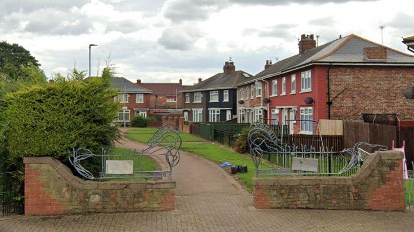 Streetview of a path between houses