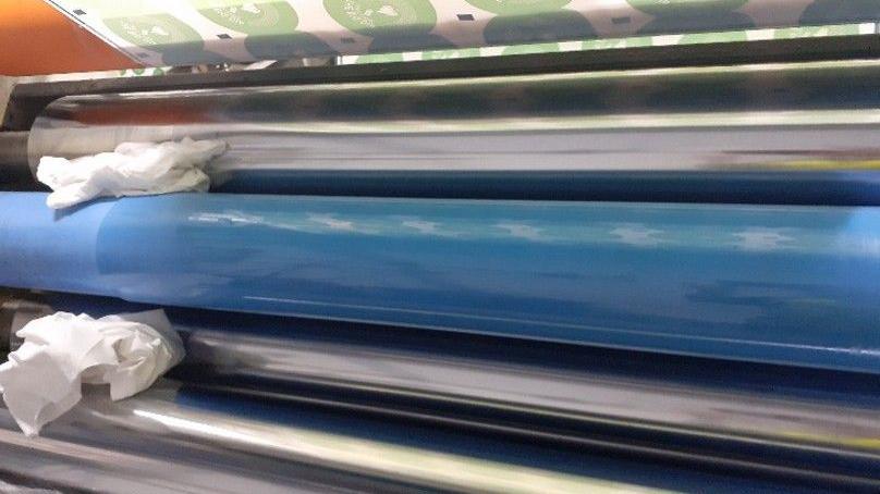 A blue and silver roller machine