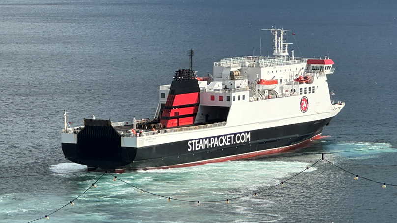 The Ben-my-Chree, which features the white, red and black colours of the Isle of Man Steam Packet Company along with it's logo on the side. The vessel also features the firms website address of STEAM-PACKET.COM in white lettering on the side.