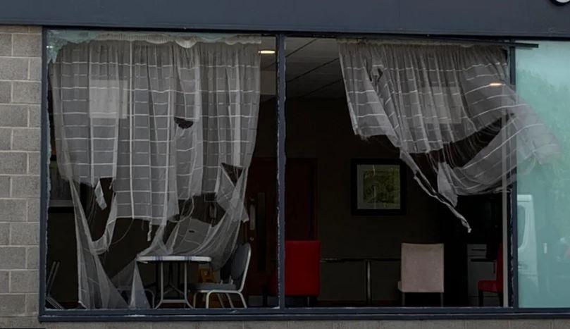 A smashed window at a hotel in Manvers, South Yorkshire, after rioters caused significant damage. 