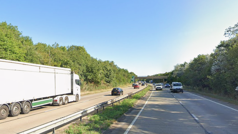 A general view of the A12 dual carriageway near Chelmsford in Essex. Cars and lorries can be seen travelling along both sides of the road on a sunny day.
