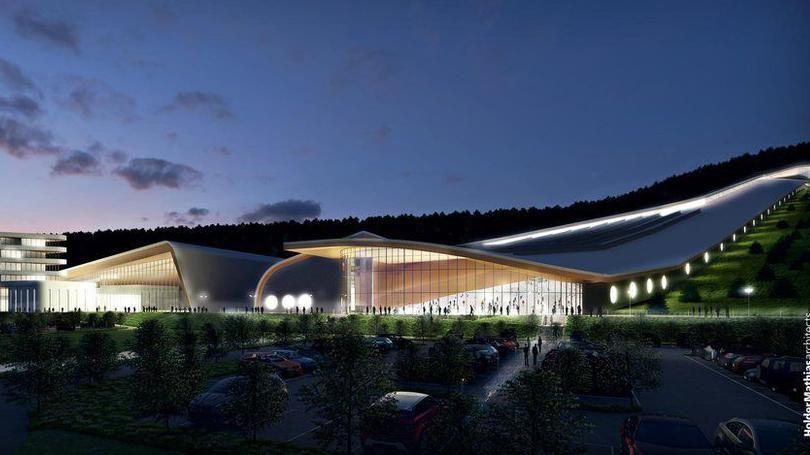 An artist's impression of how the plans might look. A long futuristic building with a rounded glass front stretches up a steep hillside with round windows running alongside the walls. There is another large building with a glass front to its left, with a large car park with shrubs between vehicles in front of the two.