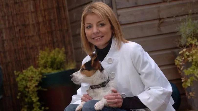 Allison pictured with her Jack Rusell, Rocky, on her lap. 