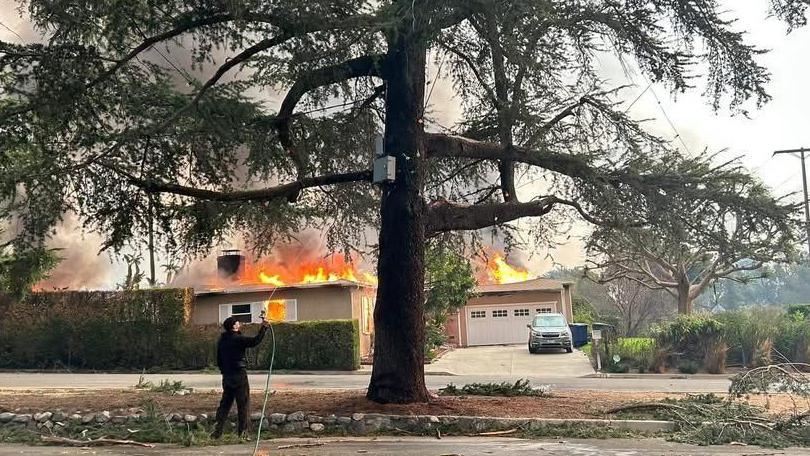 An image of a house on fire in Pasadena in Los Angeles