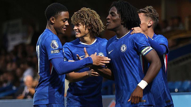 Ryan Kavuma-McQueen celebrates a Chelsea goal against Manchester City with Shumaira Mhueka