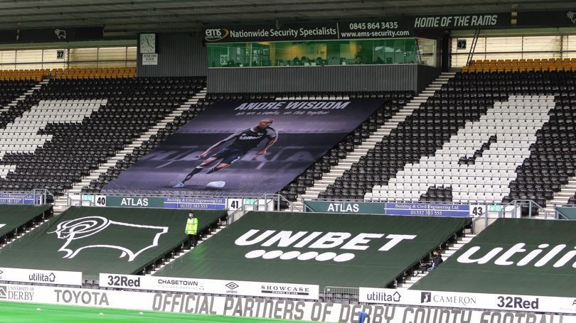 A banner to support the recovery of Derby County defender Andre Wisdom at Pride Park in July 2020