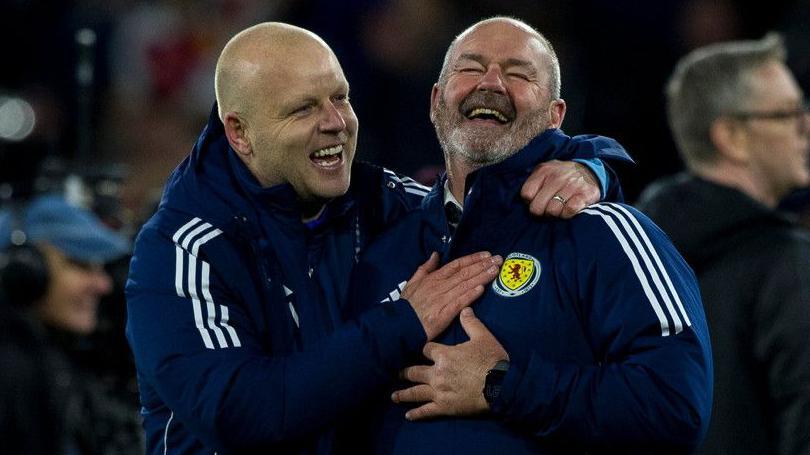Scotland's Steven Naismith and Steve Clarke celebrate World Cup qualification