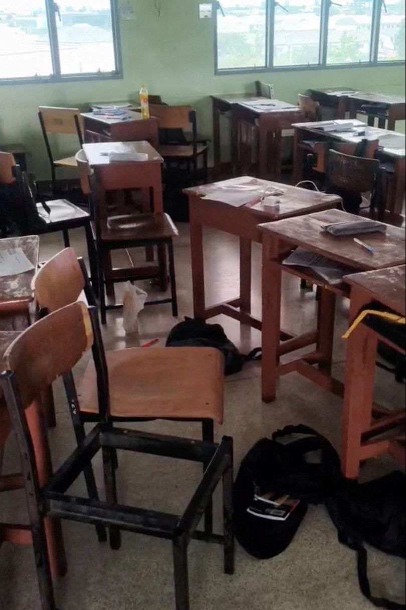 Students' belongings and furniture scattered in a classroom, following a shooting incident at Debsirin Nonthaburi School