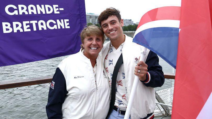 Tom Daley with coach Jane Figueiredo during the opening ceremony of the Olympic Games in Paris.