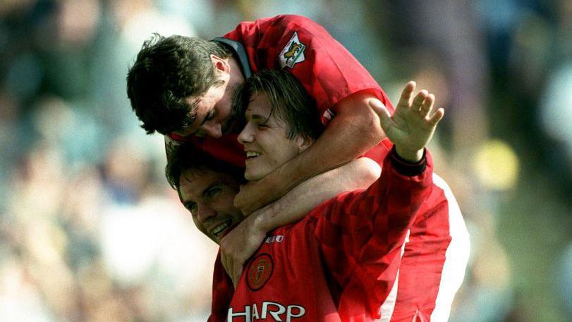 David Beckham celebrates with Roy Keane