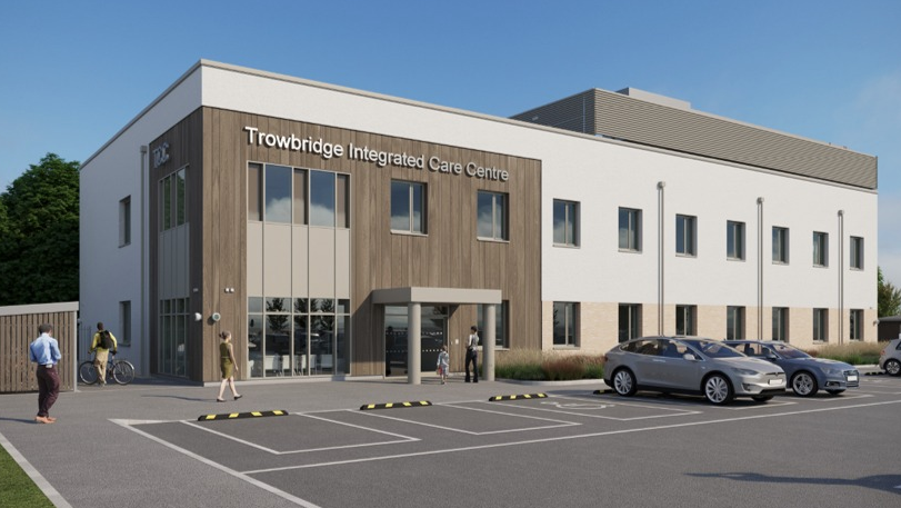 A mock-up of a building which says 'Trowbridge Integrated Care Centre' and has cars parked outside.