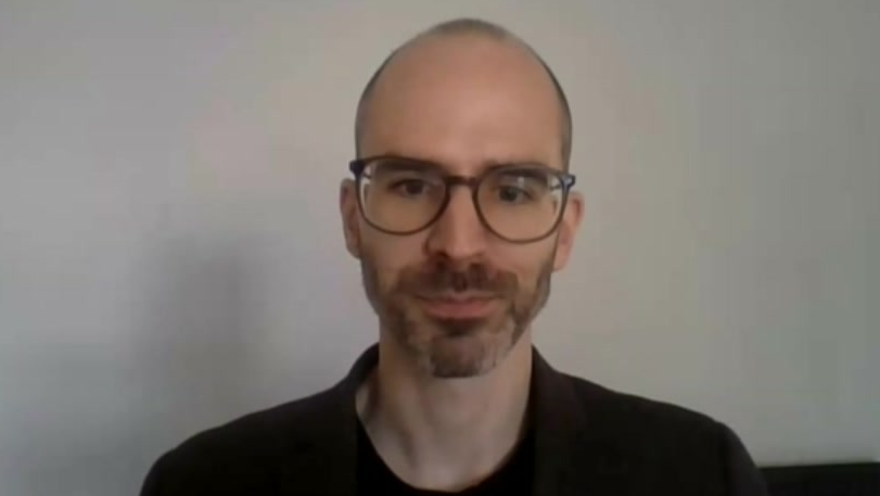 Dr James Brackley, lead author of the report, wearing glasses and a dark jumper during his interview with the BBC