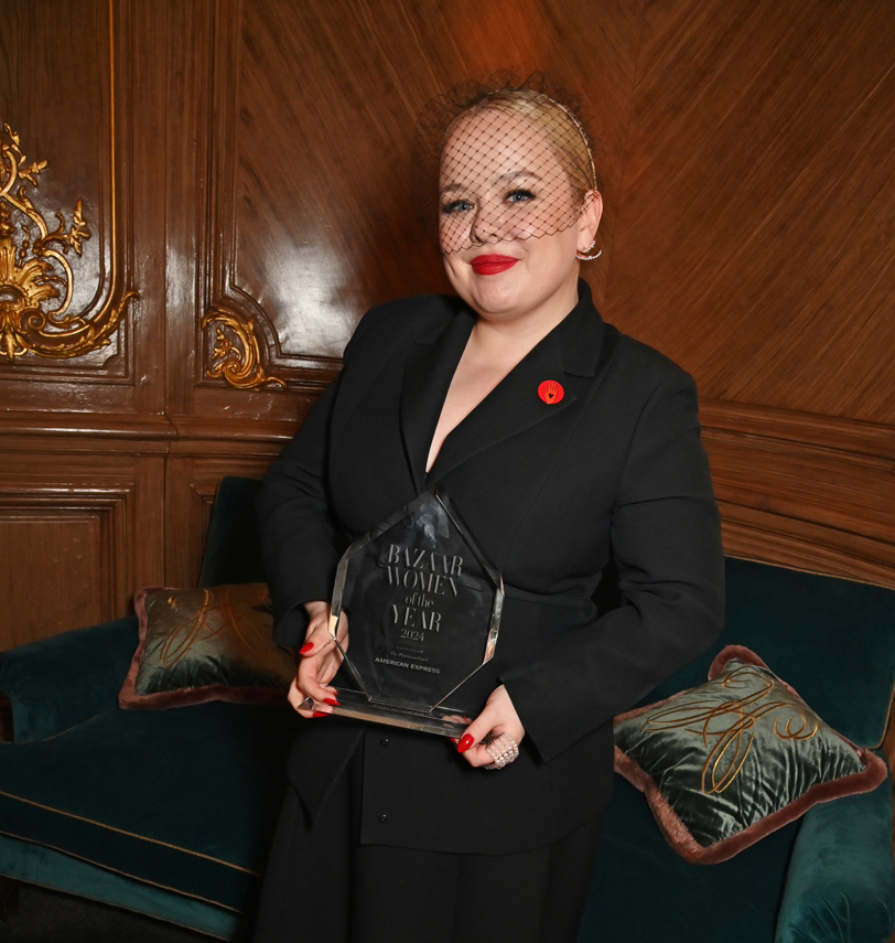 Nicola Coughlan holding an award 