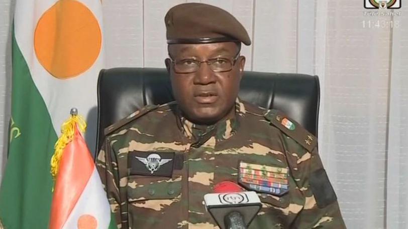 Niger leader Abdourahmane Tchiani wearing a camouflage military shirt, with glasses and a brown beret.