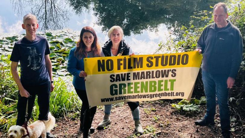 Campaigners with Joy Morrissey (second left) holding a banner