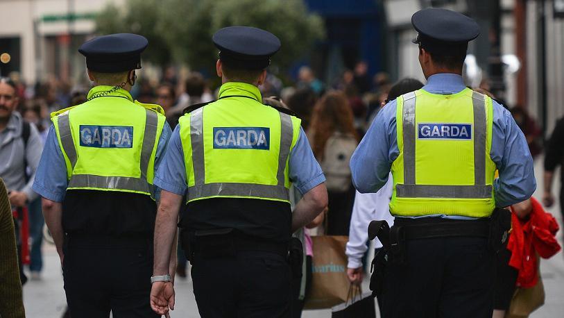 Three garda officers walking on street