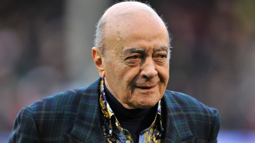 Mohamed Al Fayed head and shoulders shot wearing tartan suit and paisley pattern shirt