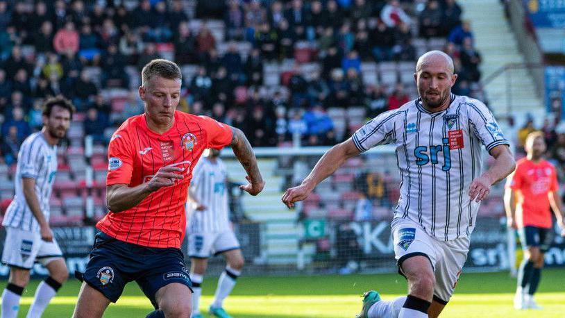 DUNFERMLINE, SCOTLAND - OCTOBER 19: Morton's Alex King (L) and Dunfermline's Chris Kane (R) in action during a William Hill Championship match between Dunfermline Athletic and Greenock Morton at KDM Group East End Park, on October 19, 2024, in Dunfermline, Scotland. (Photo by Calum Chittleburgh / SNS Group)