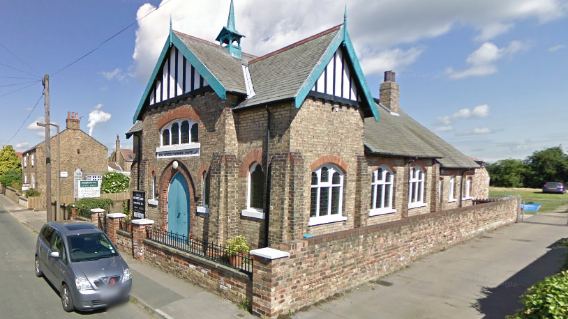 A street view of a chapel building.