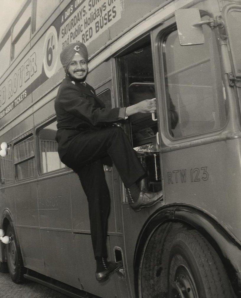 A Sikh employee displays his right to wear turban