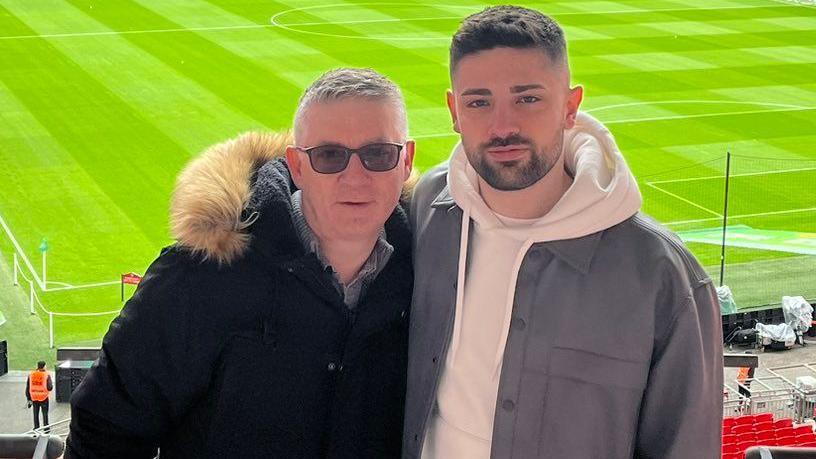 Adam Courtliff and father at football stadium