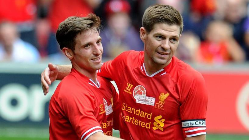 Joe Allen celebrates with Steven Gerrard in 2013