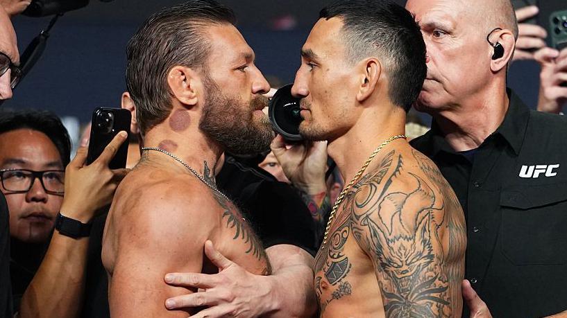 Conor McGregor and Max Holloway face off