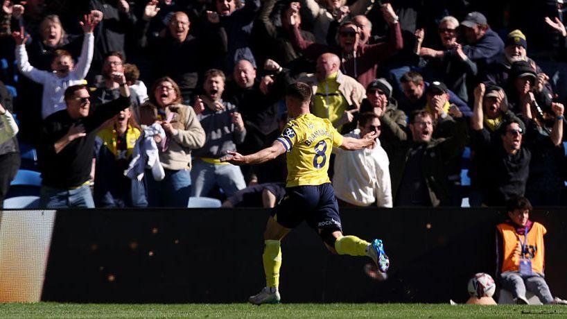 Cameron Brannagan celebrates his high-class equaliser for Oxford United against Cardiff City