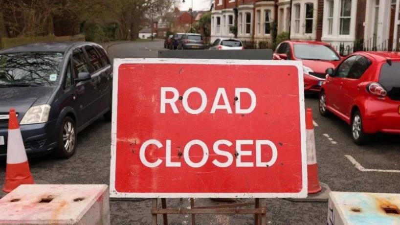 A road closed sign