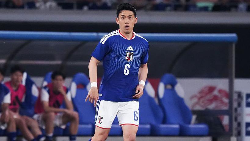 Wataru Endo in a blue Japan kit