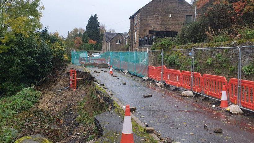 Outdoor image of a road closure due to a landslip

