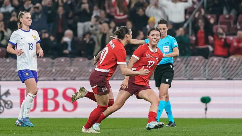 Ramona Bachmann of Switzerland (L) celebrating her goal with her teammate Naomi Luyet