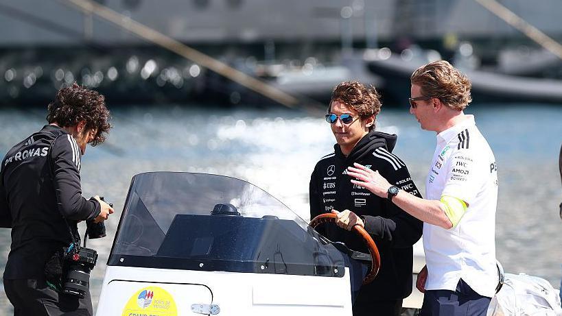 Kimi Antonelli arriving by boat into the Monaco paddock