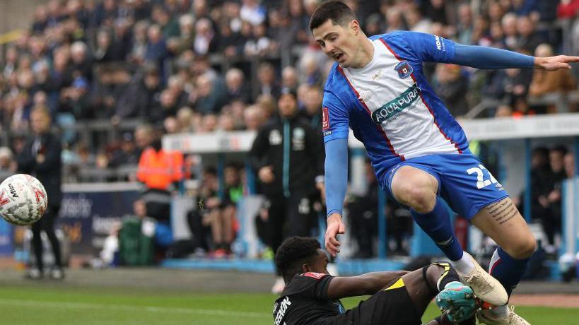 Jon Mellish of Carlisle United during the FA Cup First Round match between Carlisle United and Wigan Athletic at Brunton Park in Carlisle in November (Photo: Getty Images)