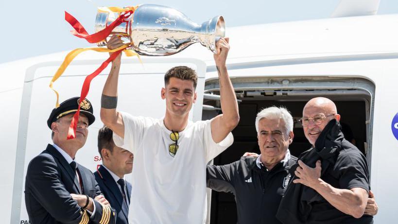 Alvaro Morata lifts the Henri Delaunay Trophy