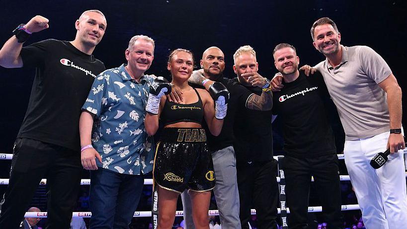 Tiah-Mai Ayton posing with her team after her professional debut win