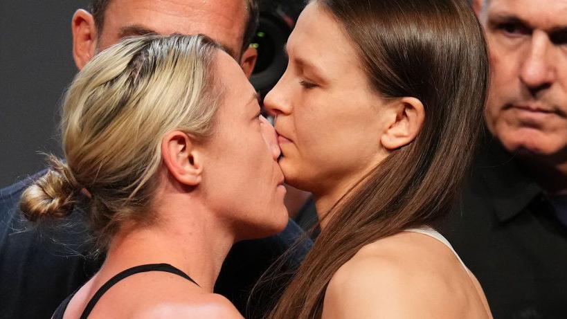 Molly McCann puts her nose right into he face of her opponent during a face-off