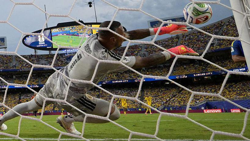 Curacao goalkeeper Eloy Room makes a save during his side's World Cup draw against Ecuador